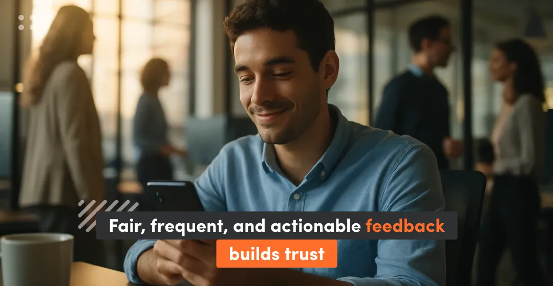 man at the desk in company with inscription about fair feedback that builds trust