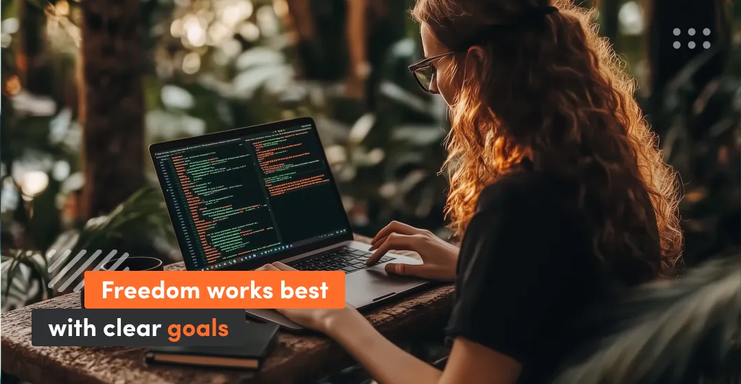 Woman with desktop and sentence about freedom with clear goals