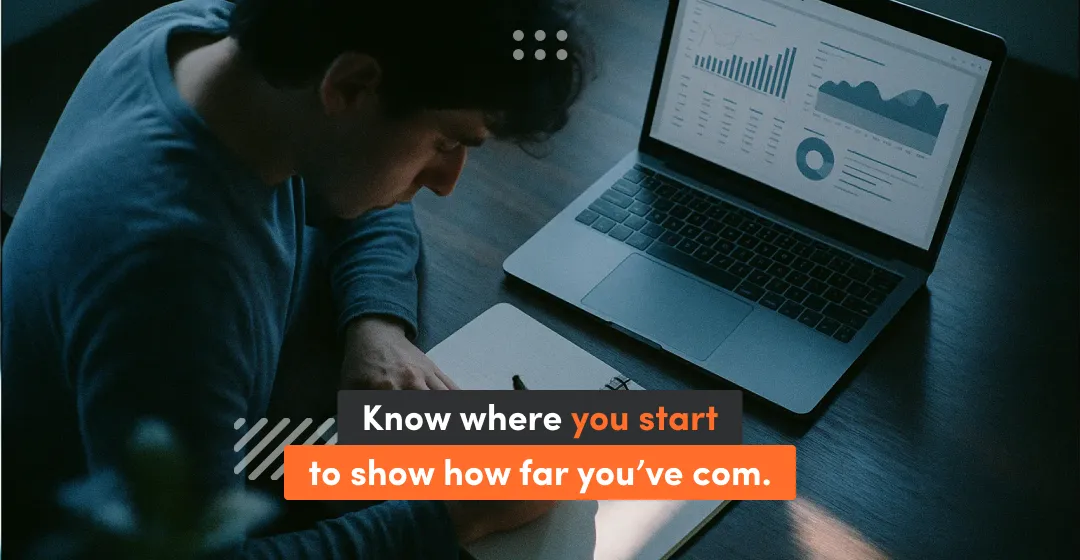 Man with desktop with inscription "know where you start to show how far you've com"