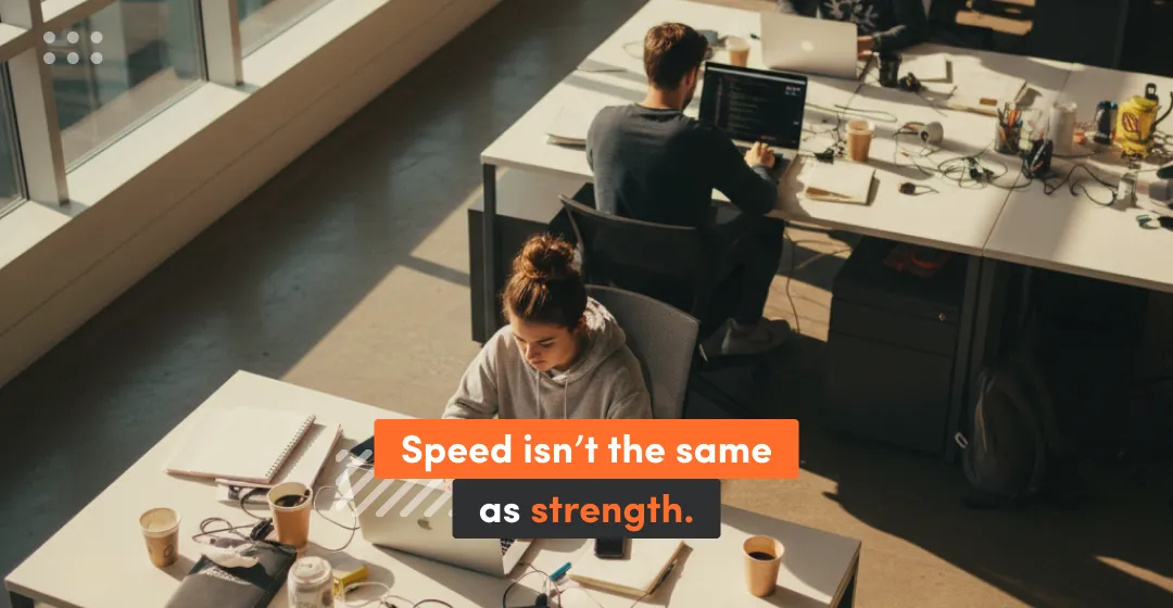 two people in front of the desks and inscription about speed and strength